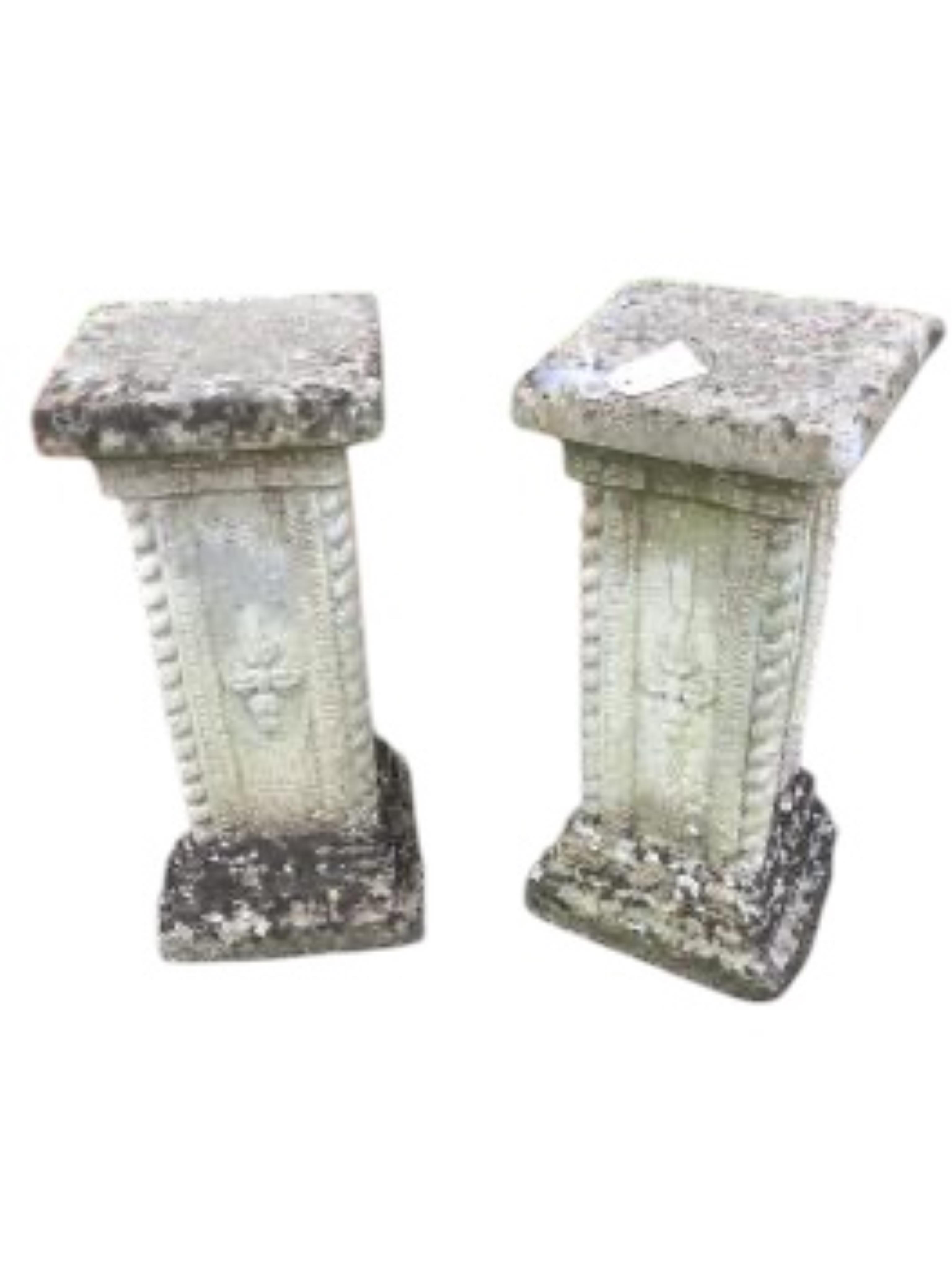 A pair of reconstituted stone garden pedestals, height 56cm